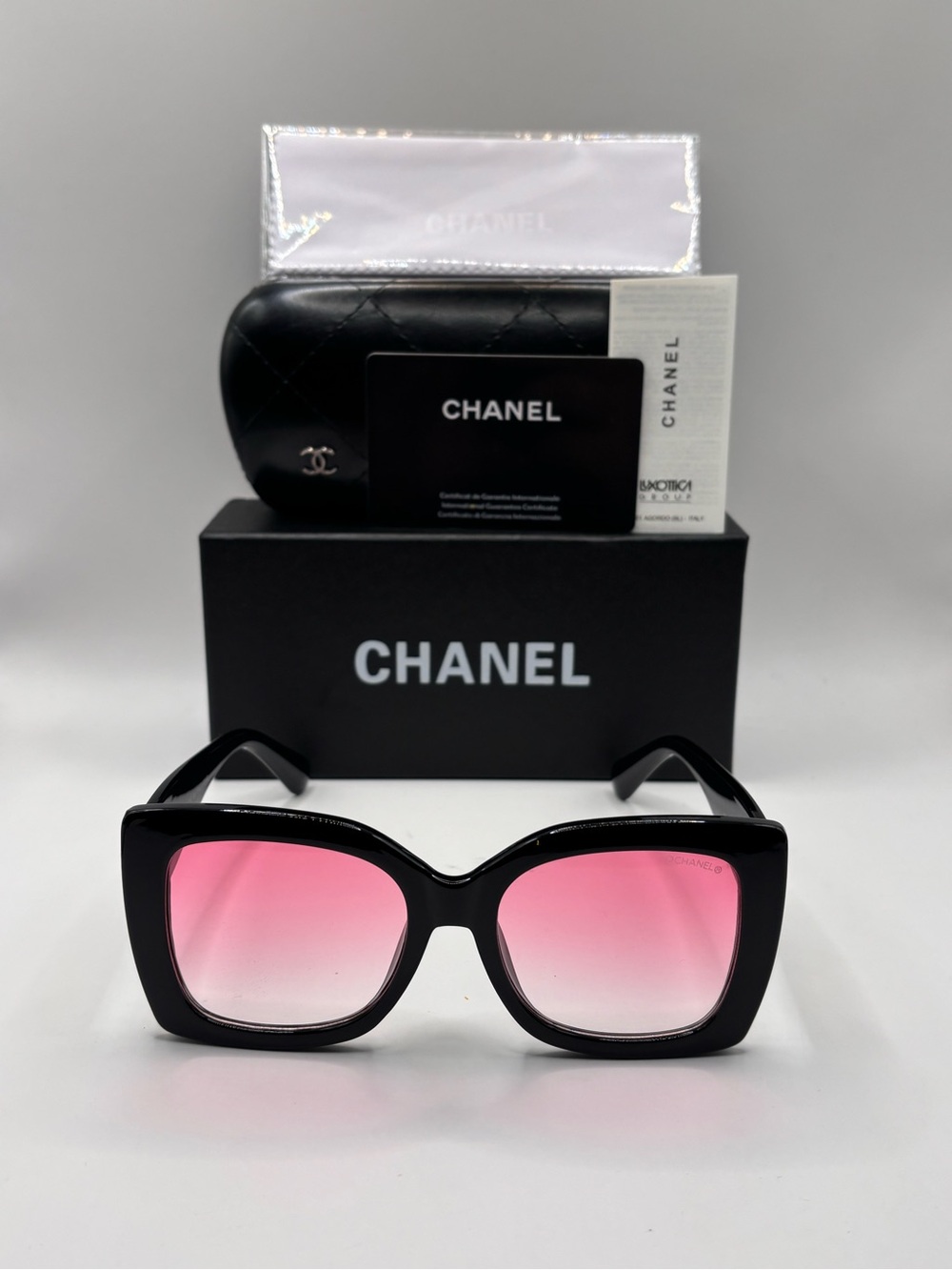 Chanel Women’s Black Frame Sunglasses with Pink Gradient Lenses
